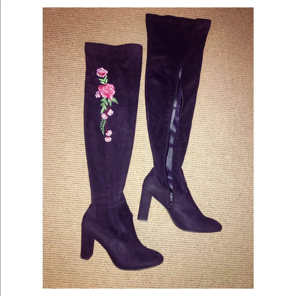 Knee high black boots with rose decal on front